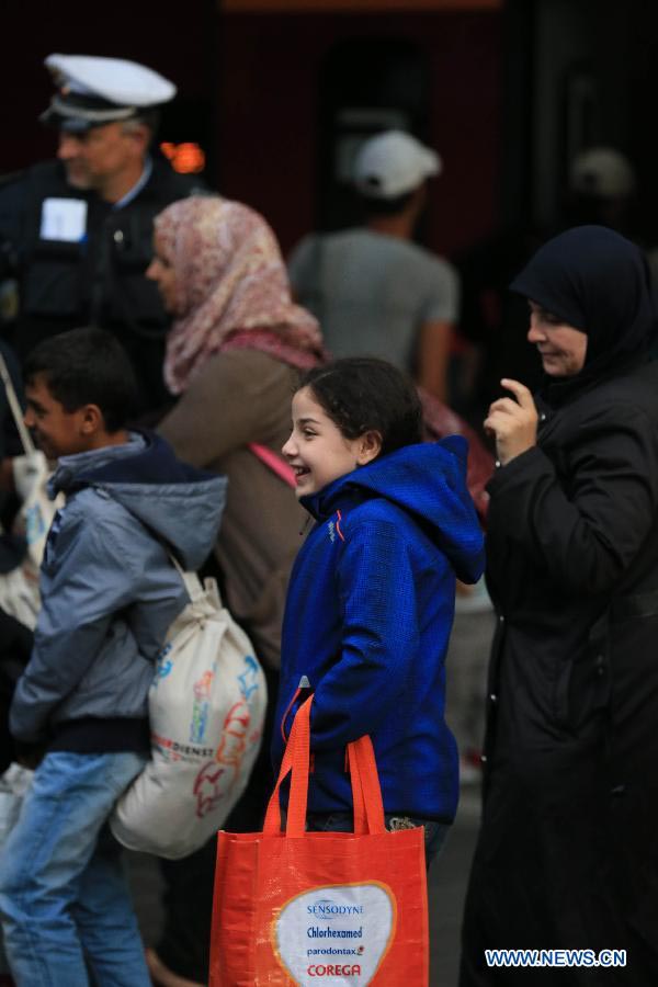 Milhares de refugiados chegam à esta??o central de Munique