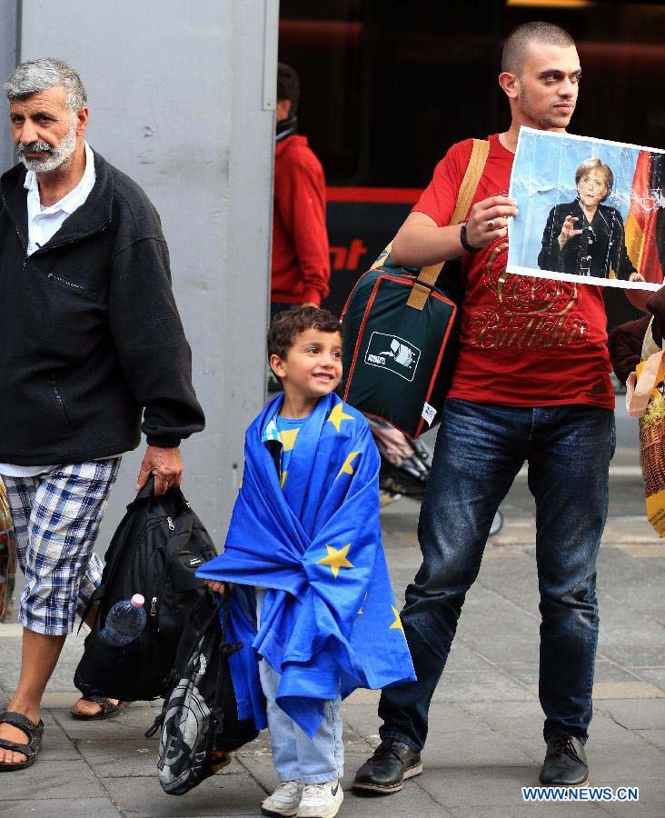Milhares de refugiados chegam à esta??o central de Munique