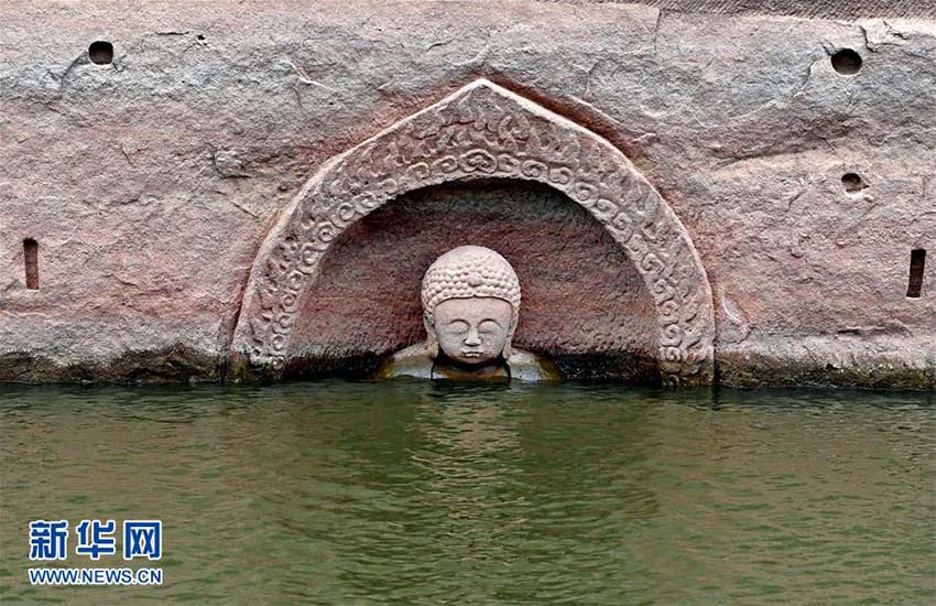 Província de Jiangxi: Buda antigo descoberto em reservatório após redu??o do nível de água