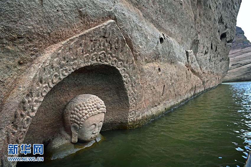 Província de Jiangxi: Buda antigo descoberto em reservatório após redu??o do nível de água