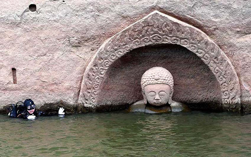 Província de Jiangxi: Buda antigo descoberto em reservatório após redu??o do nível de água