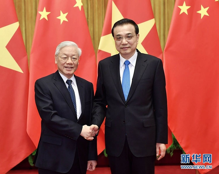 Altos líderes chineses discutem com chefe do partido vietnamita sobre la?os mais fortes