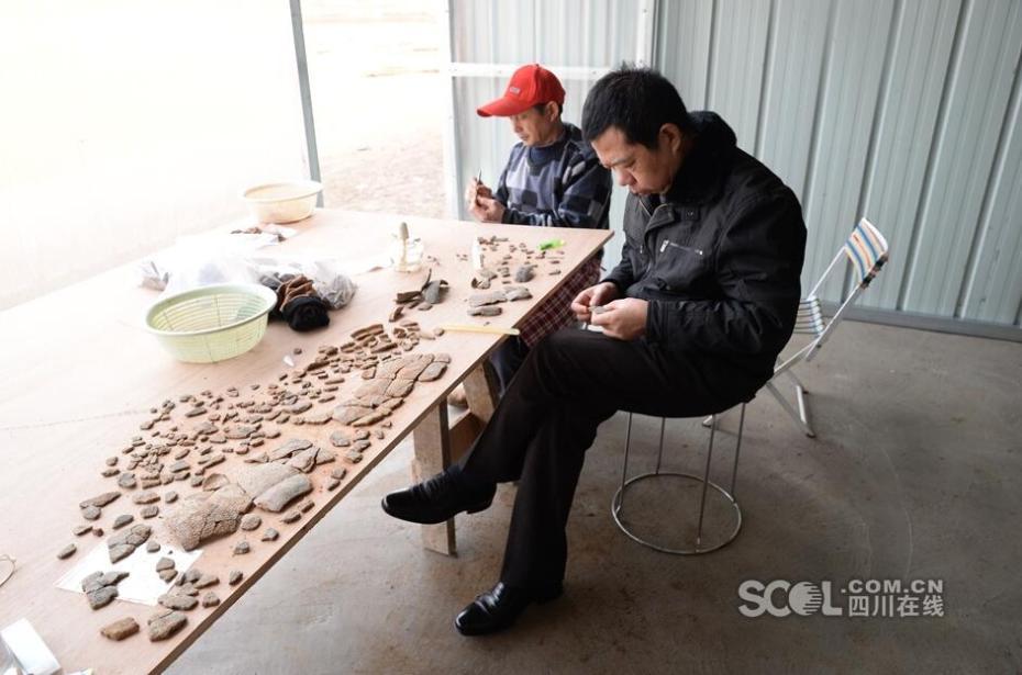 Conjunto de caix?es em forma de barco com 2200 anos descobertos na província de Sichuan