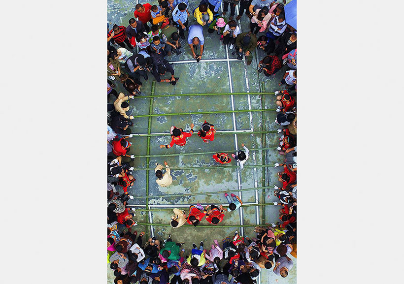 Celebra??es do Festival do Barco-Drag?o na China registradas em cole??o fotográfica