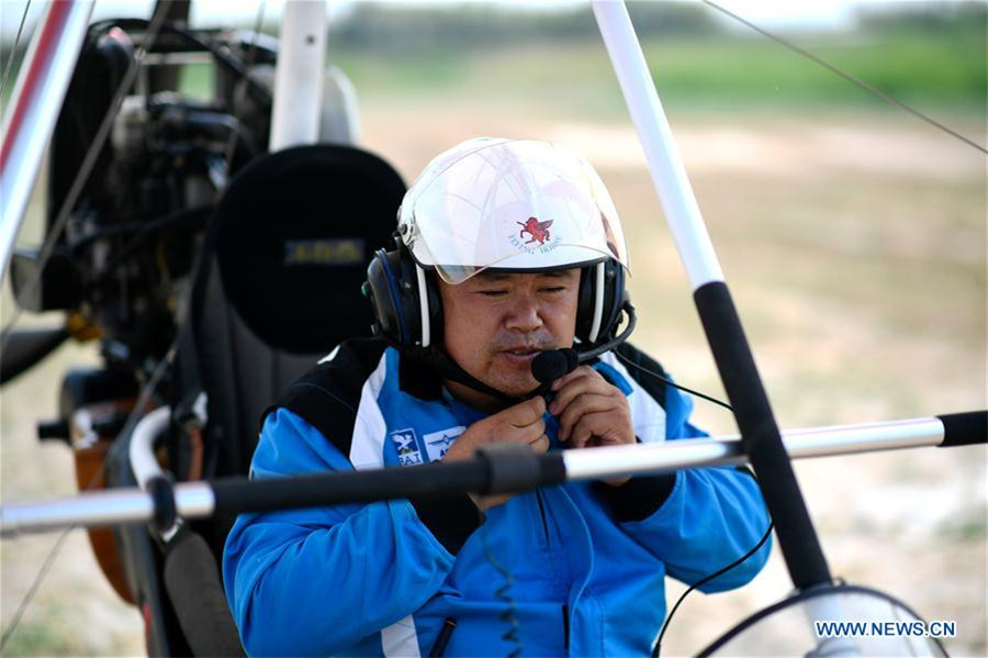 Agricultor chinês compartilha sua paix?o por esportes aéreos