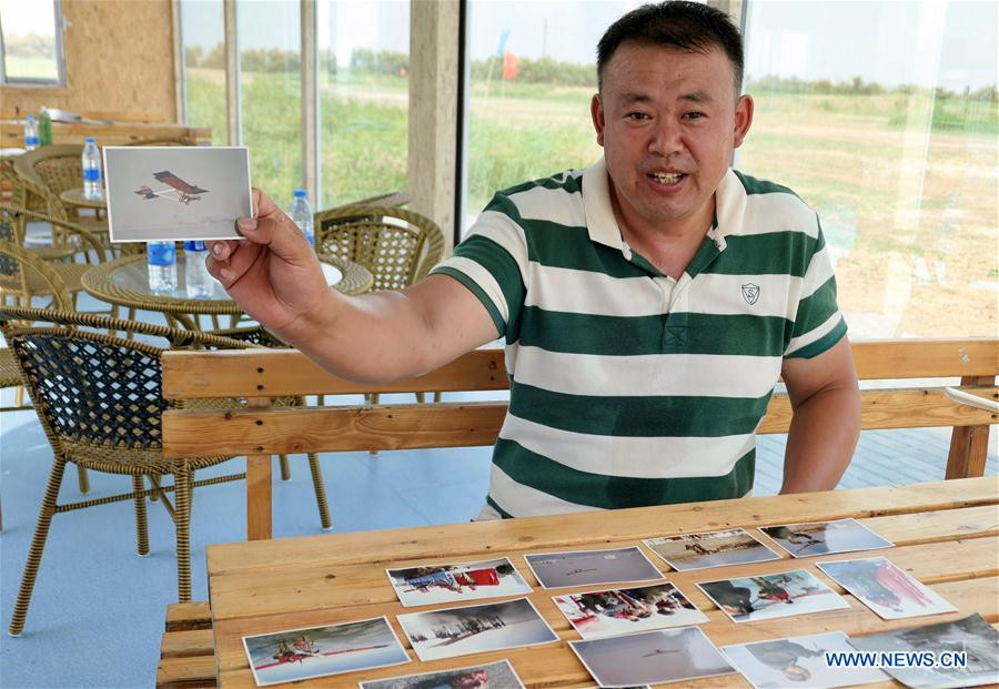 Agricultor chinês compartilha sua paix?o por esportes aéreos