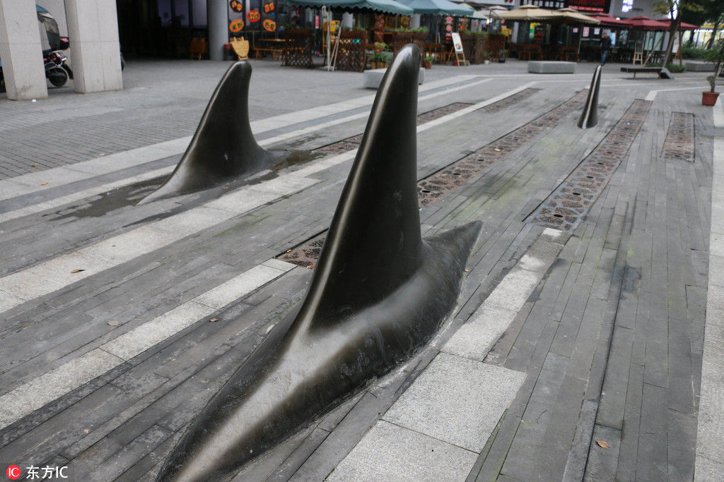 Chongqing estabelece cones de sinaliza??o rodoviária em forma de barbatana de tubar?o