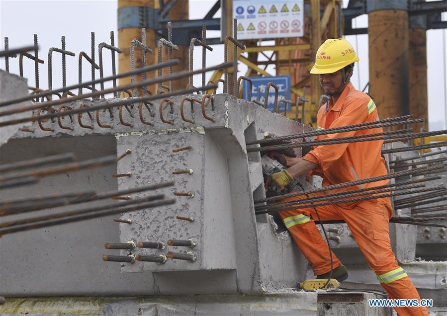 Arco principal de ponte transfronteiri?a selado no Sudoeste da China