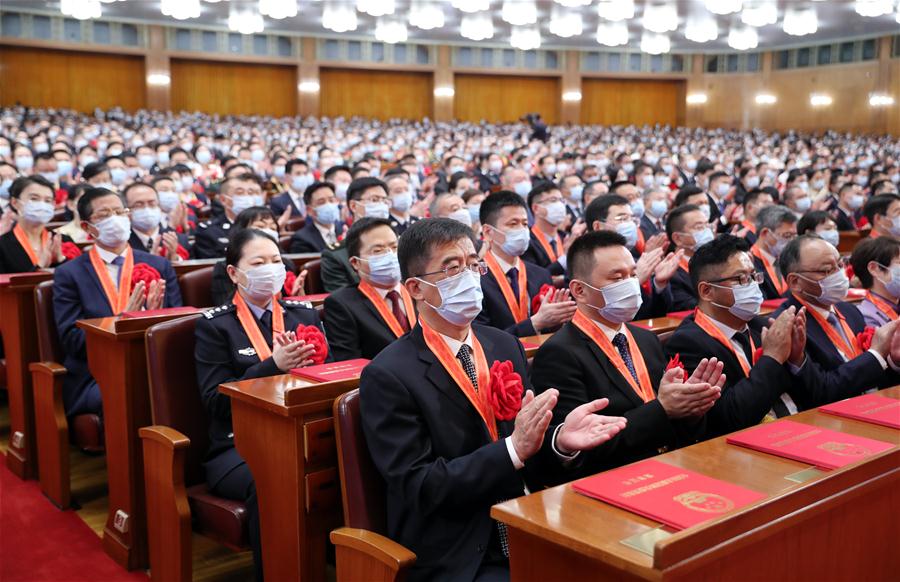 China realiza reuni?o para homenagear exemplos na luta contra COVID-19