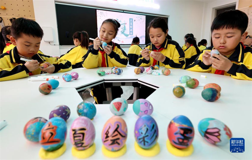 China: atividades tradicionais assinalam aproxima??o do ver?o