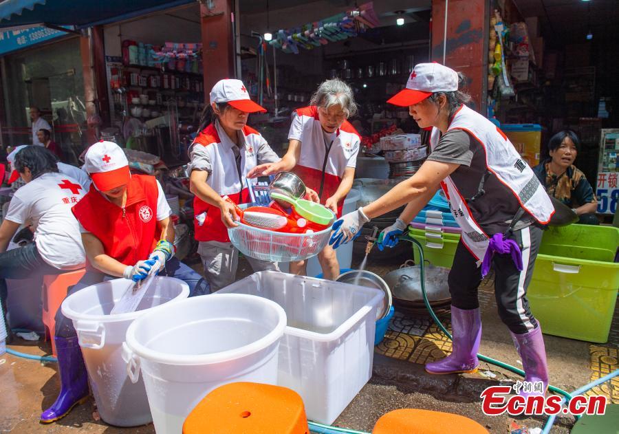 Servi?os de resgate e socorro intensificados decorrem em Chongqing após inunda??es