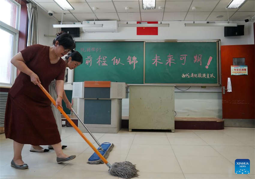 Beijing: escolas iniciam processo de reconstru??o após cheias