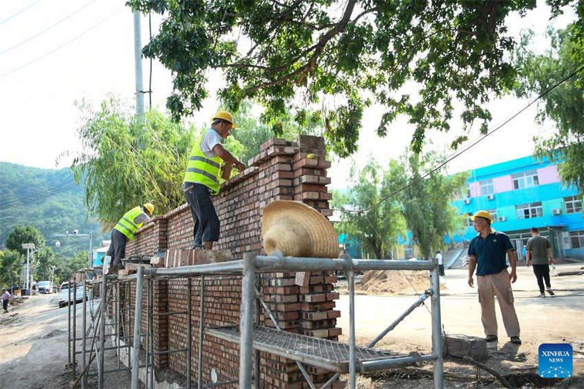 Beijing: escolas iniciam processo de reconstru??o após cheias