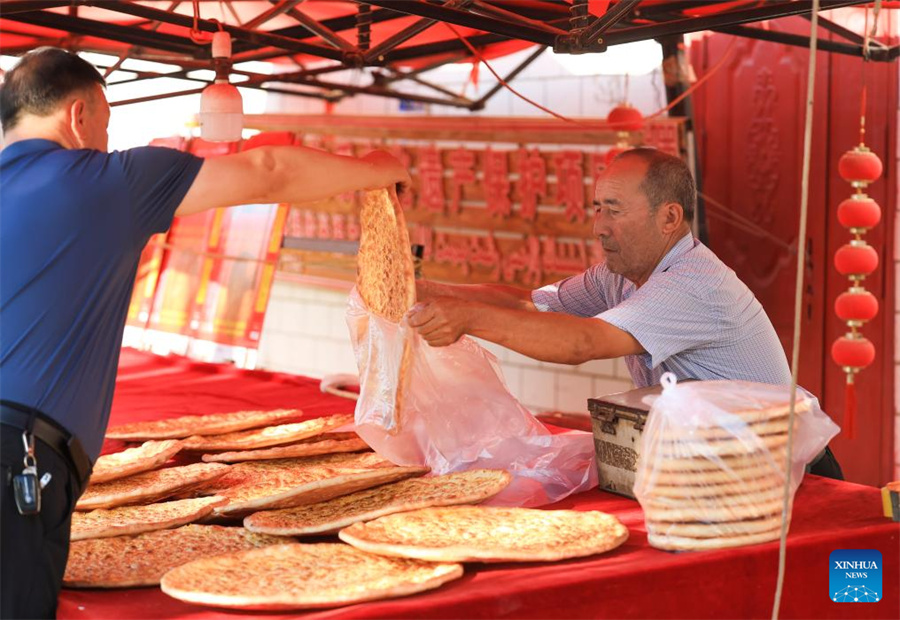 Técnicas tradicionais de fabrica??o de naan herdadas e desenvolvidas em Xinjiang
