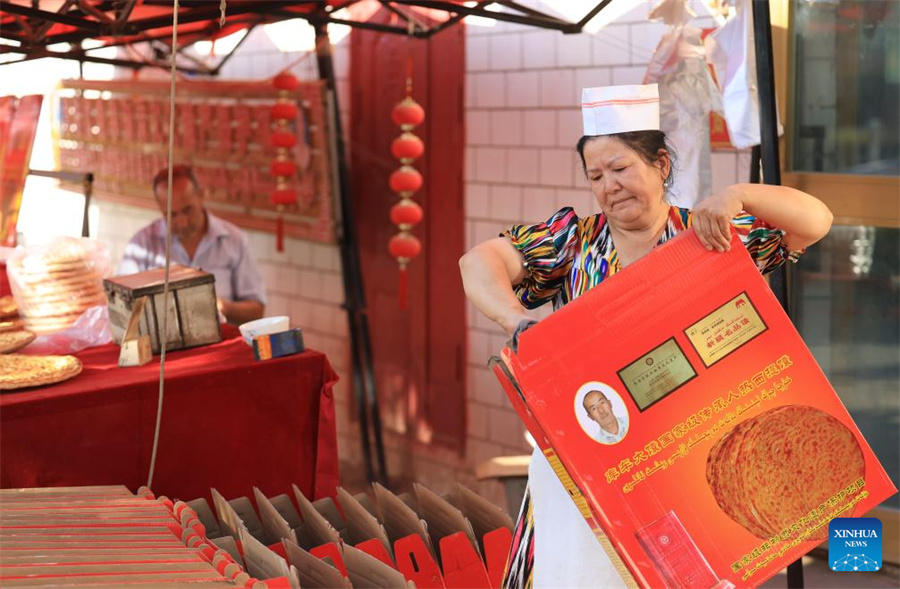 Técnicas tradicionais de fabrica??o de naan herdadas e desenvolvidas em Xinjiang