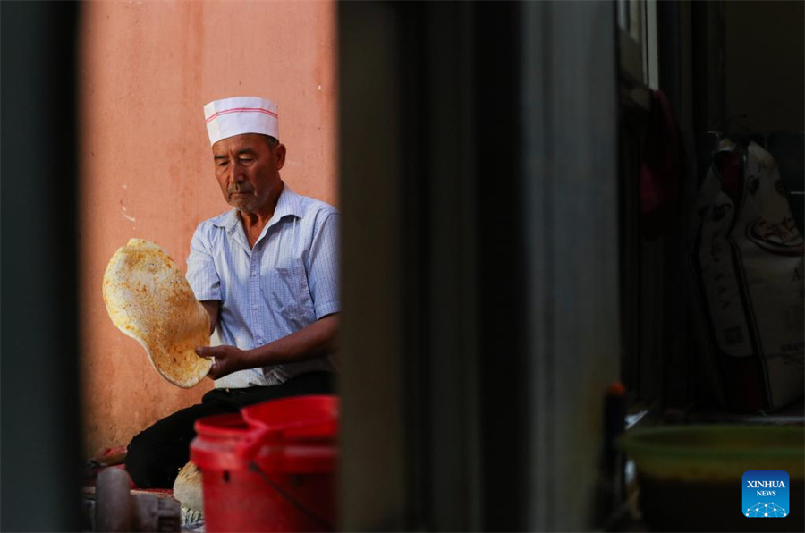 Técnicas tradicionais de fabrica??o de naan herdadas e desenvolvidas em Xinjiang